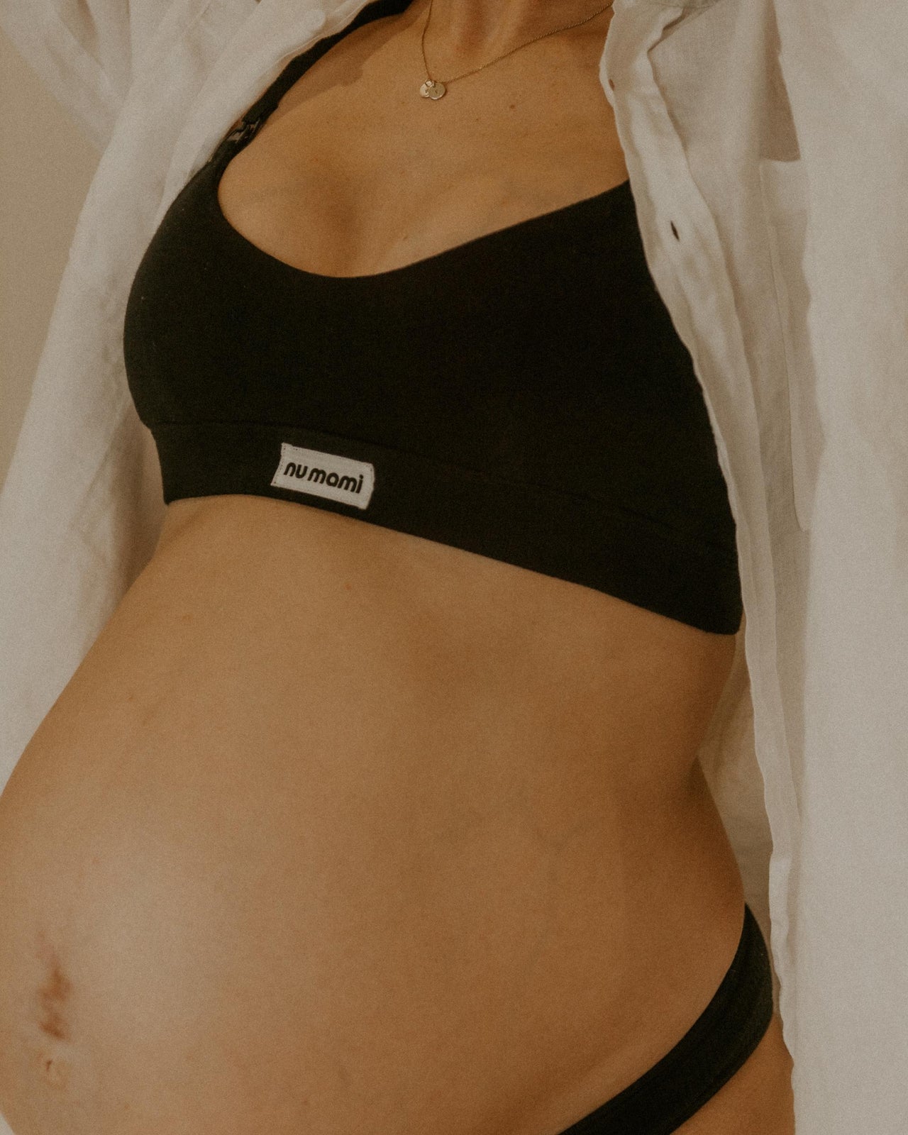 Leakproof maternity bra in black worn by pregnant women